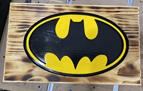 burnt batman sign